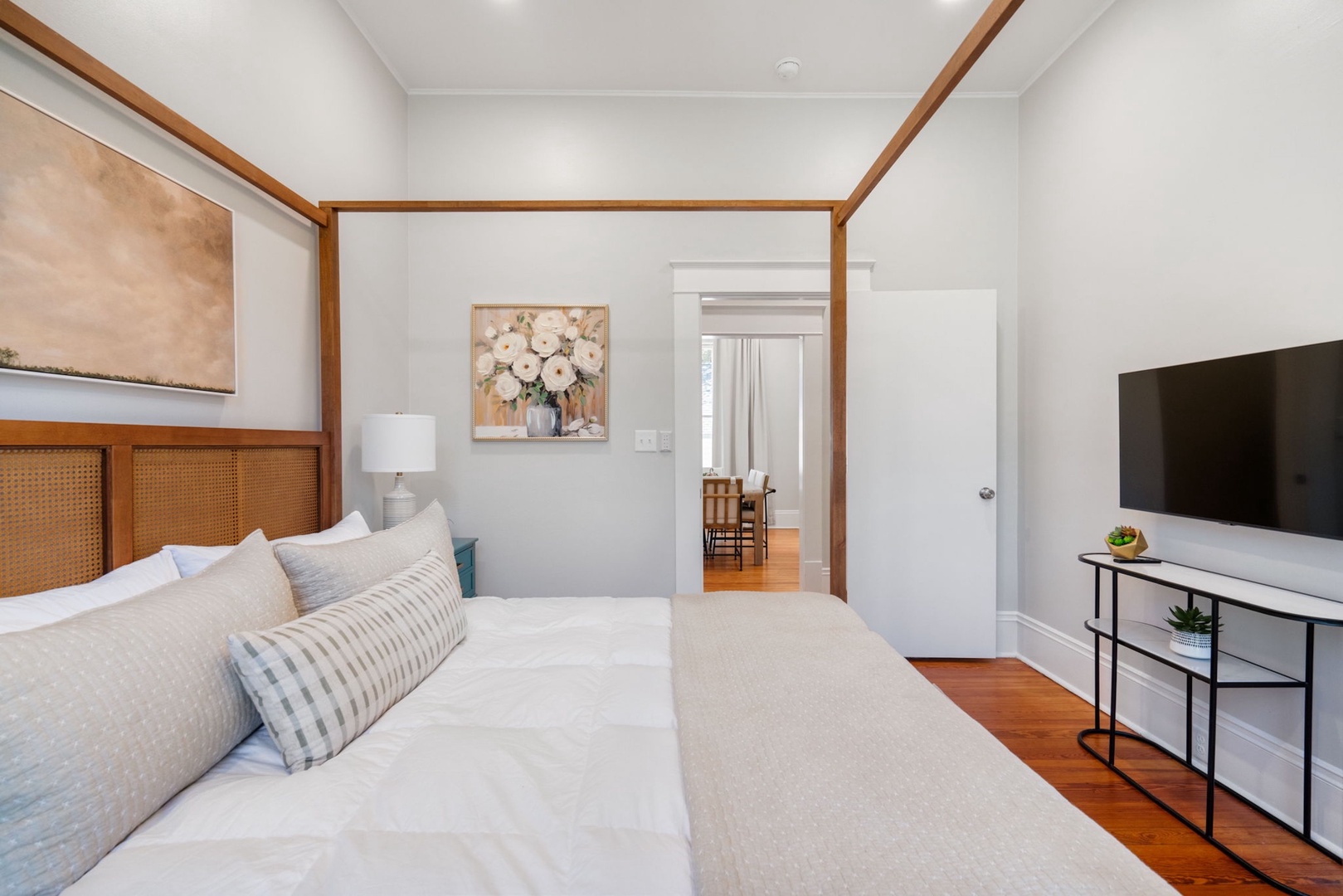 A regal king-sized bed & Smart TV await in the final bedroom retreat