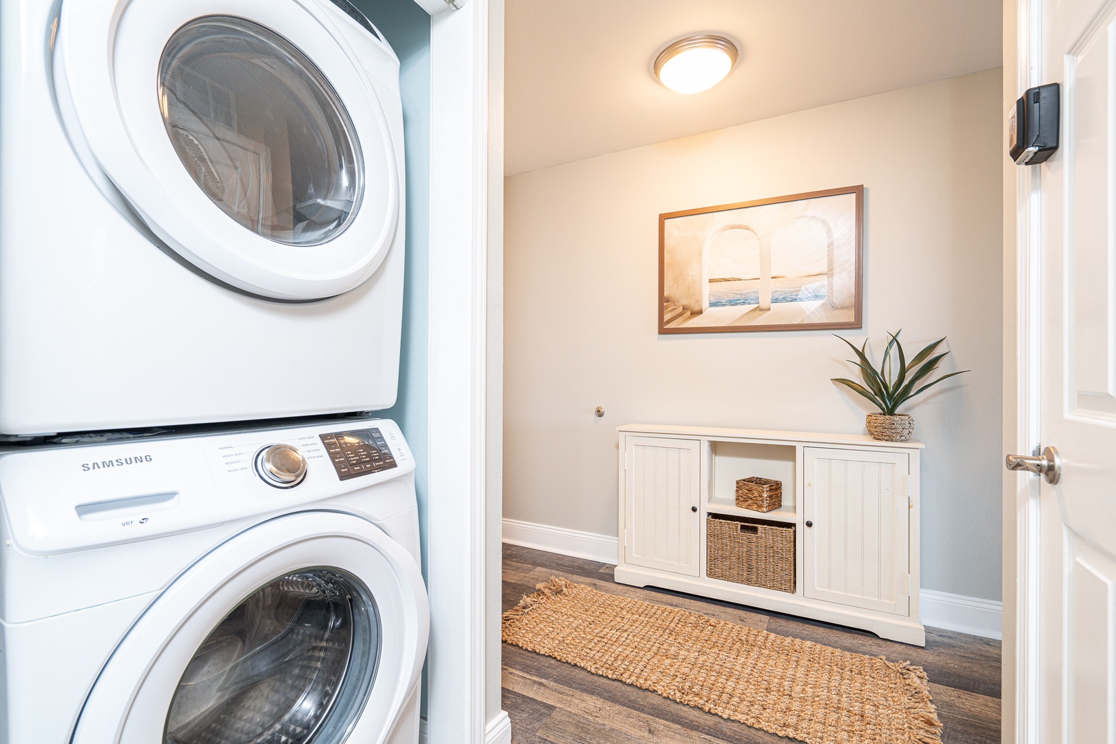 The entryway offers laundry & a snug sleeping nook for a warm welcome