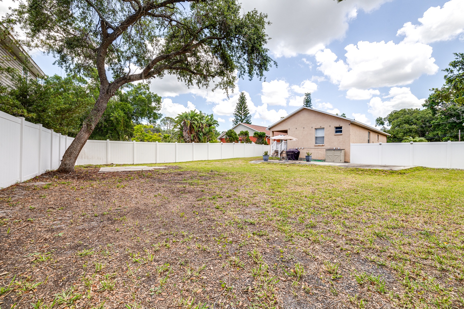 The fenced back yard offers loads of space for relaxation & play!