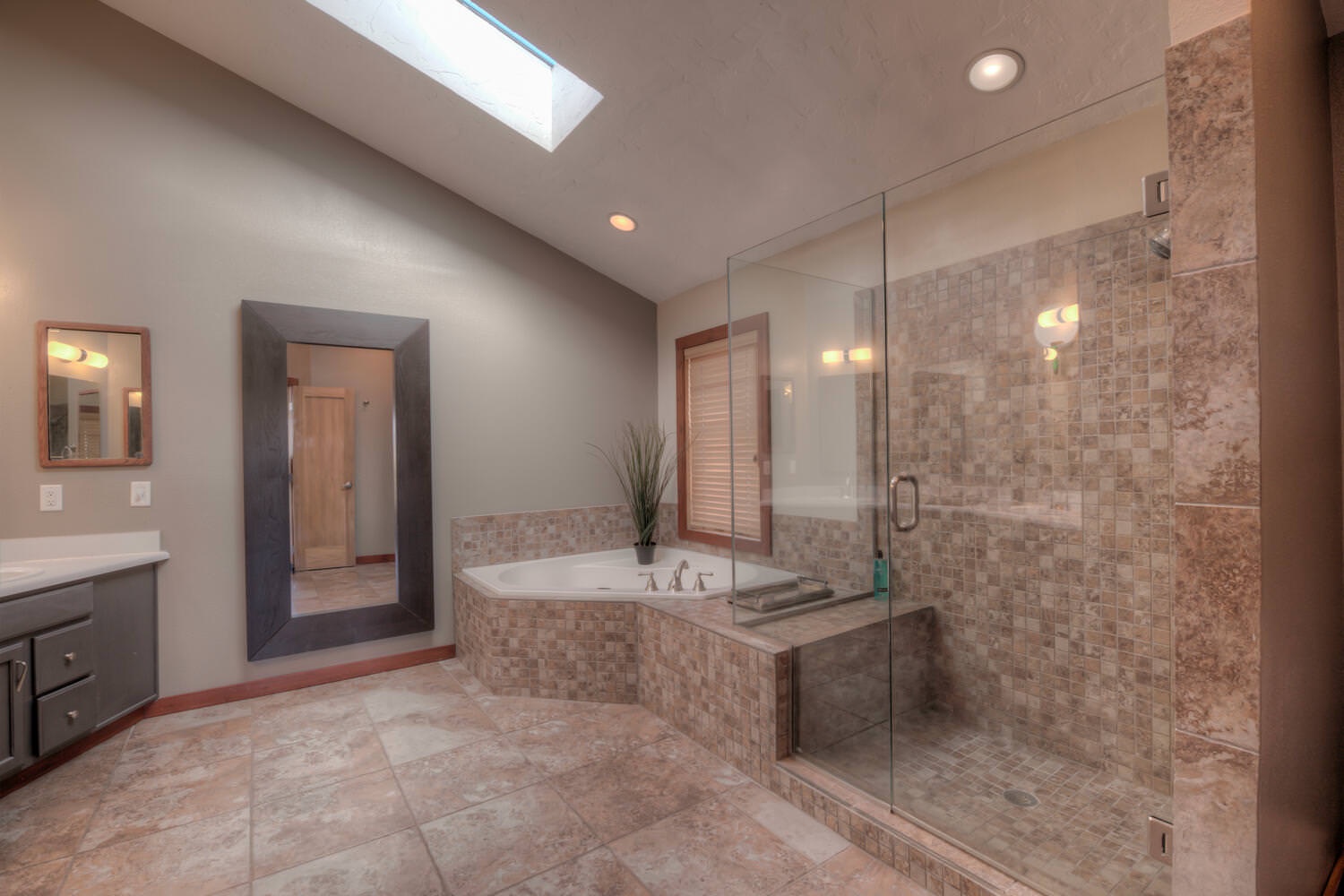 Master bedroom bathroom with separate jacuzzi tub, and stand up shower
