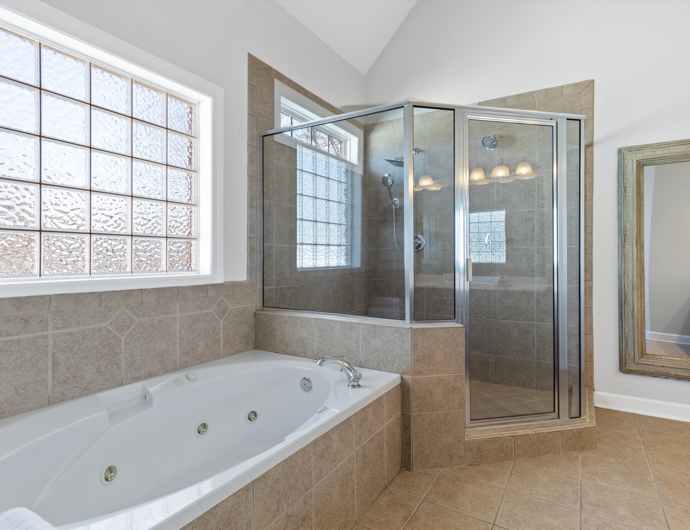 En-suite bathroom with separate shower, and tub