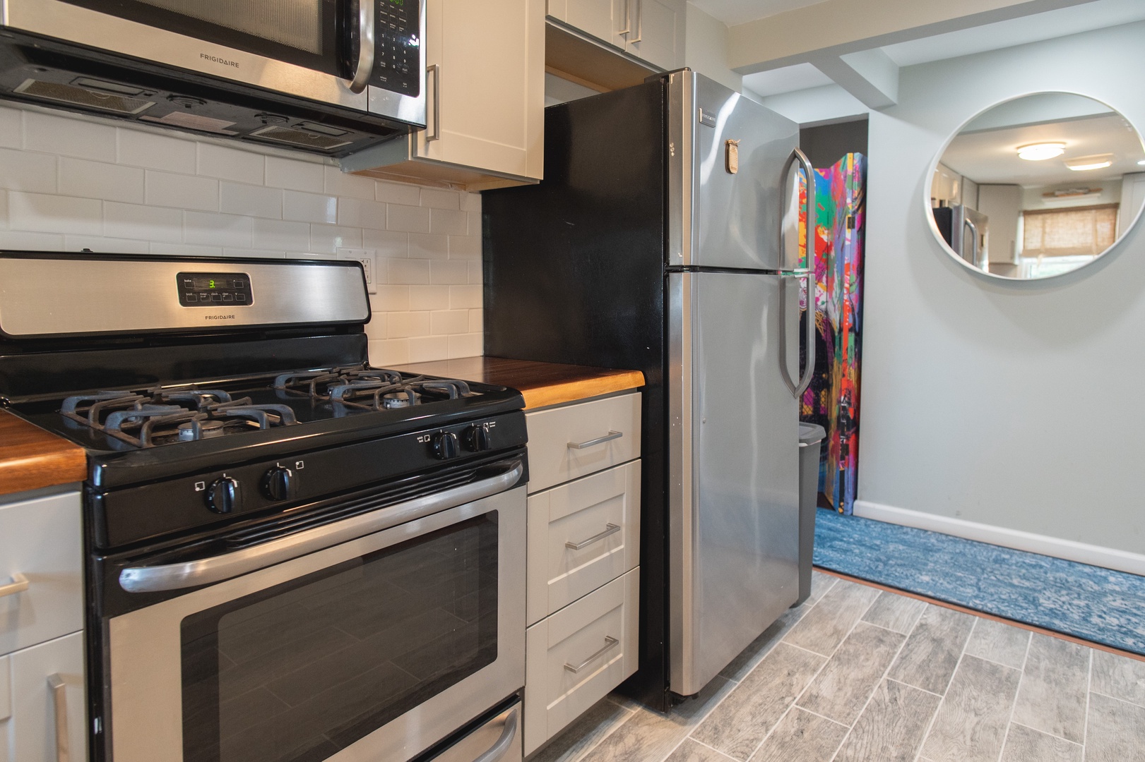 The apartment’s cozy kitchen offers ample space & all the comforts of home