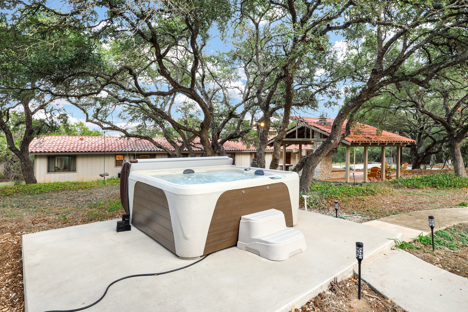 Soak your cares away in the bubbling private hot tub