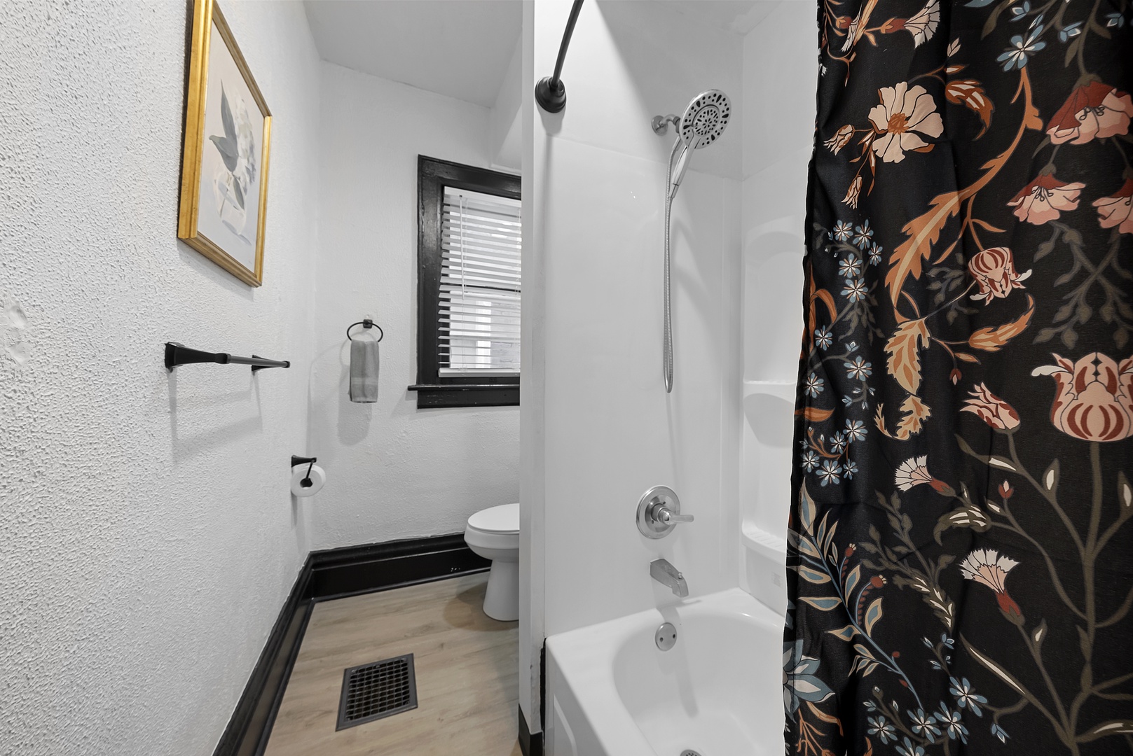 The full bath in Apartment 1166 features a single vanity & shower/tub combo