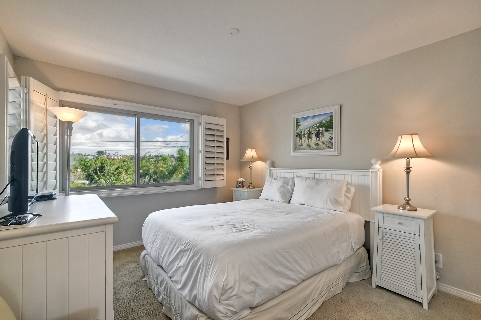 The 2nd floor bedroom offers a comfy queen bed & Smart TV