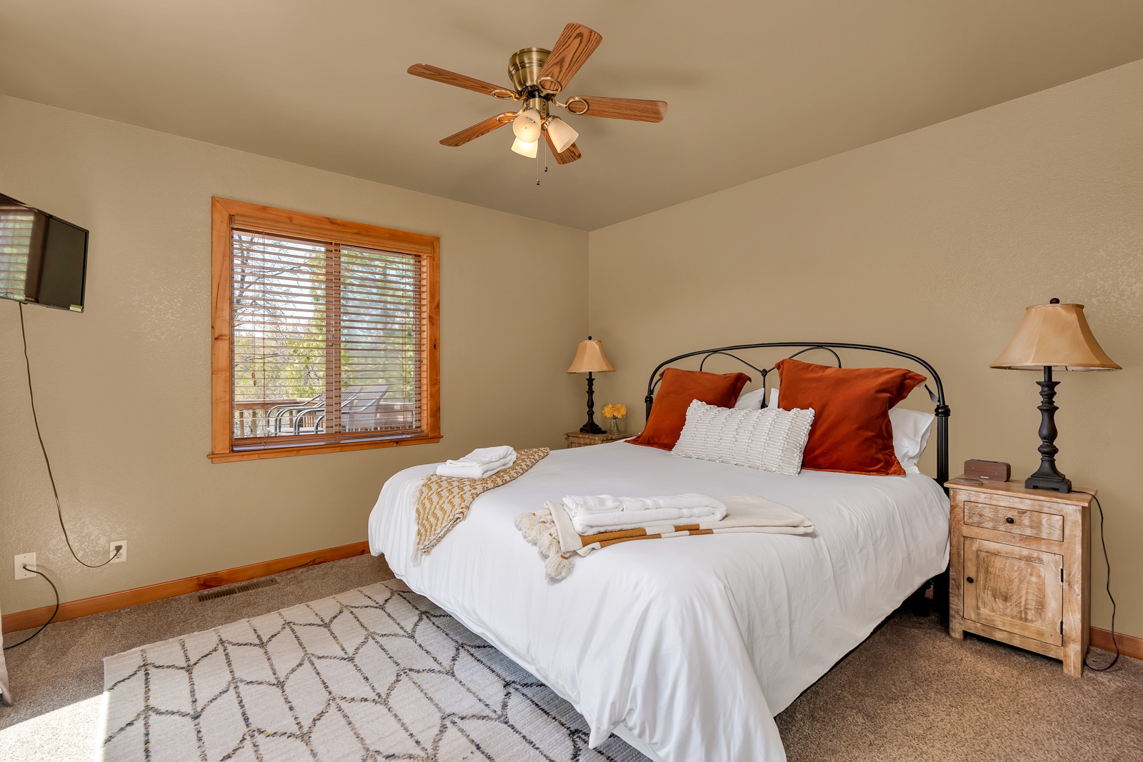 An additional king bedroom on the main level offers a Smart TV & deck access