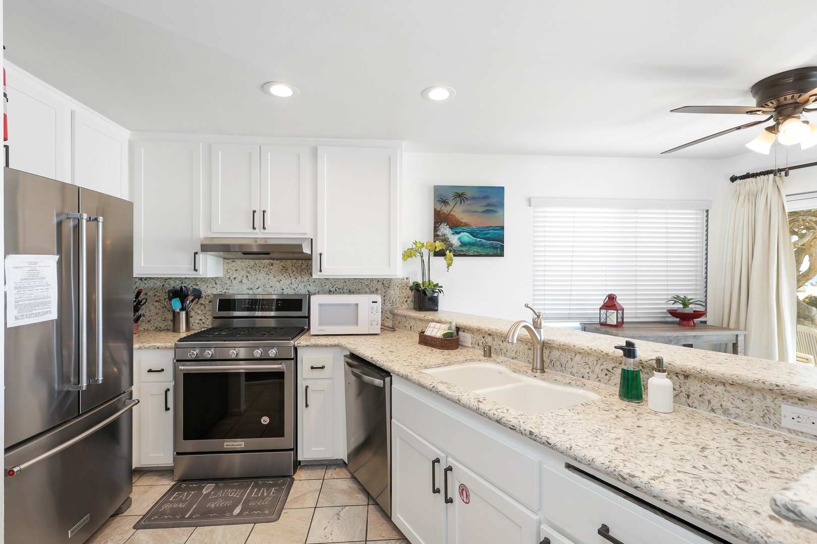 The open, airy kitchen offers ample space & all the comforts of home