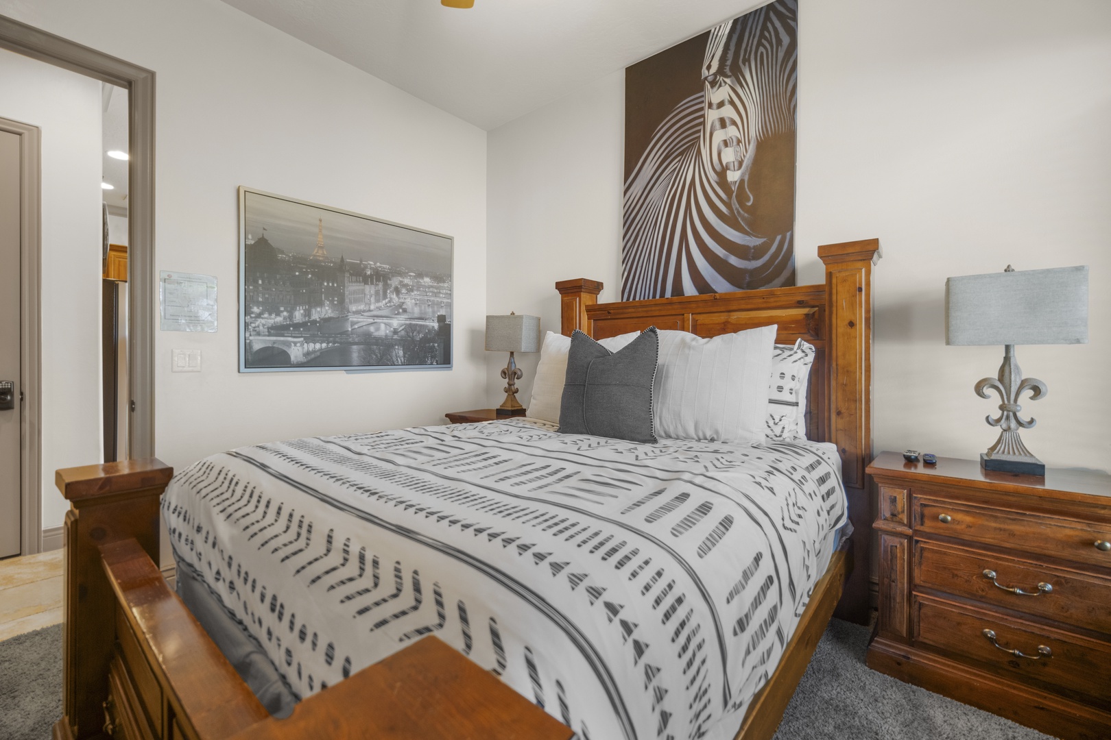 Recharge in the second bedroom, boasting a queen bed & smart TV