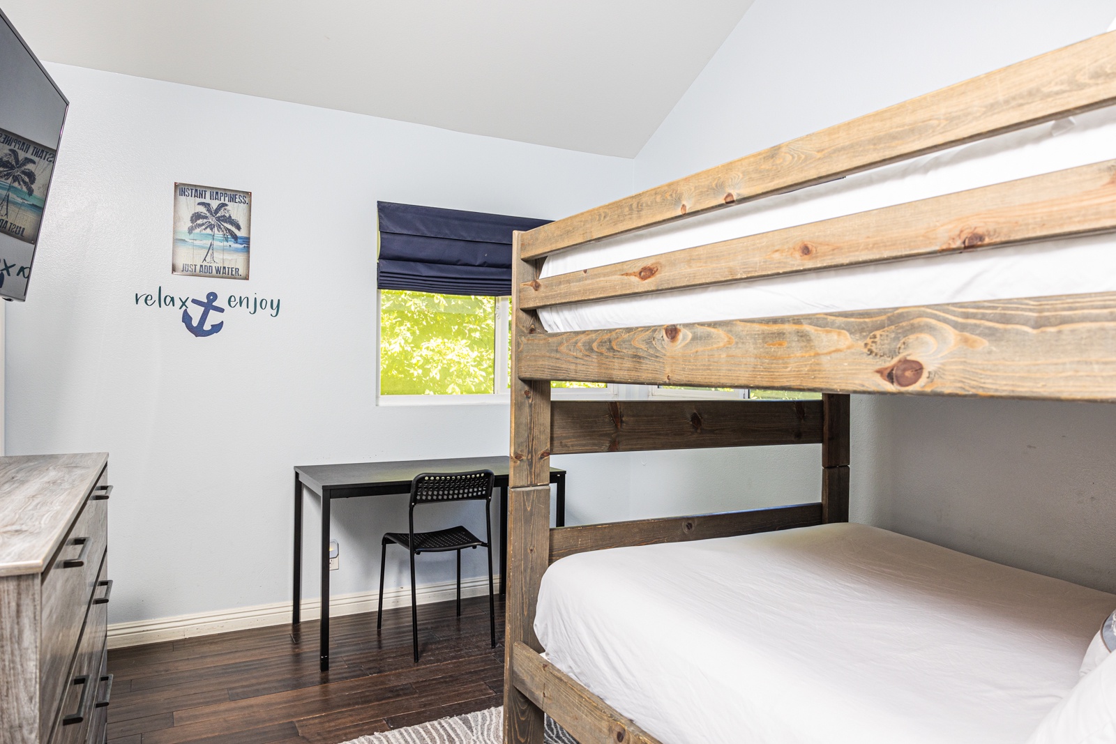 Recharge in the final bedroom, offering a full-sized bunk beds