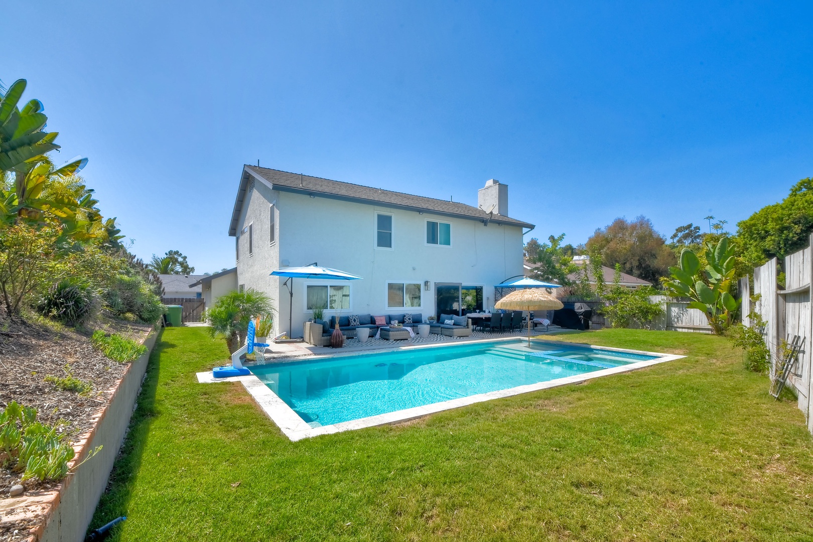 Backyard with ample seating and private pool