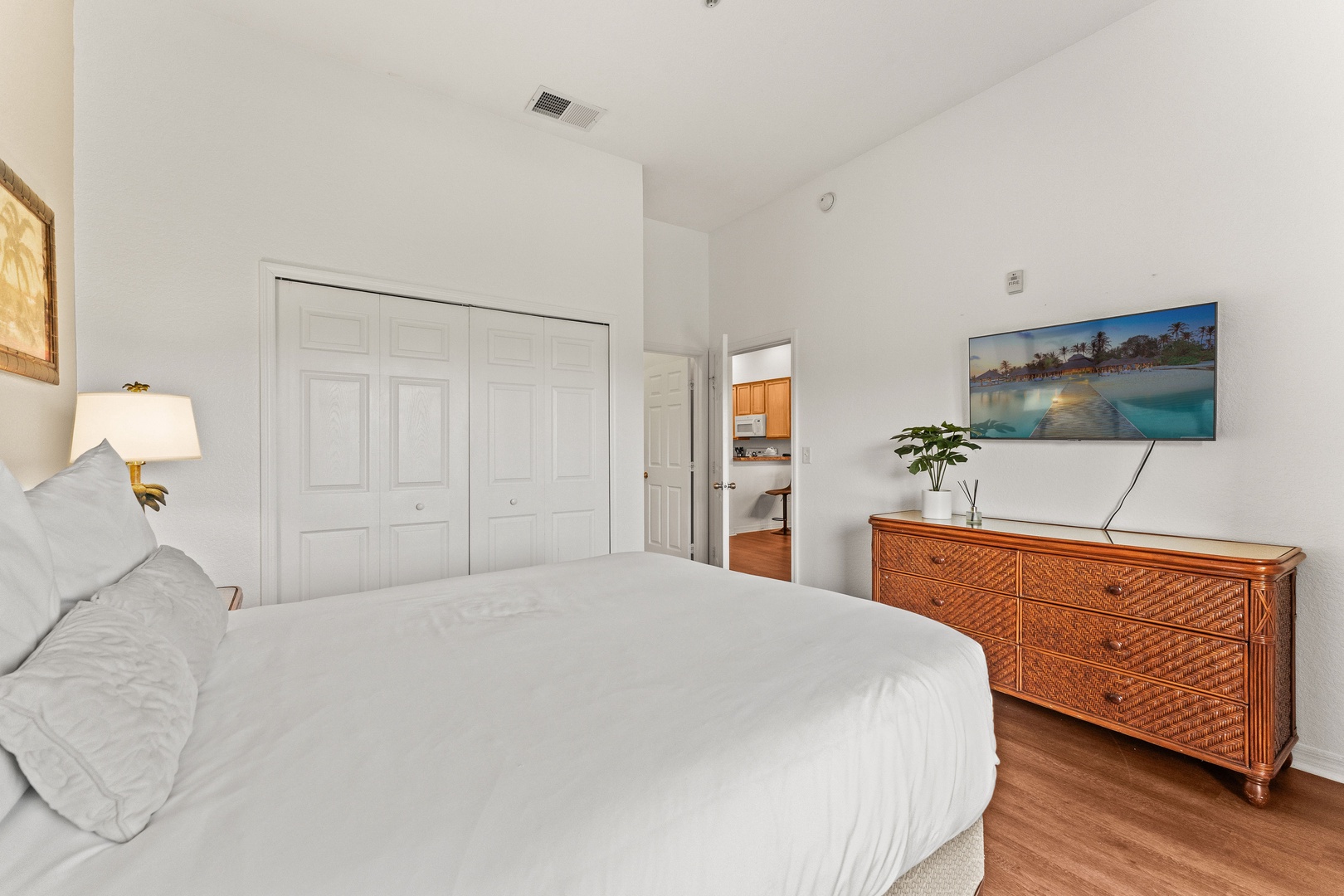 Bedroom 2 with queen bed, balcony, Smart TV, and ensuite