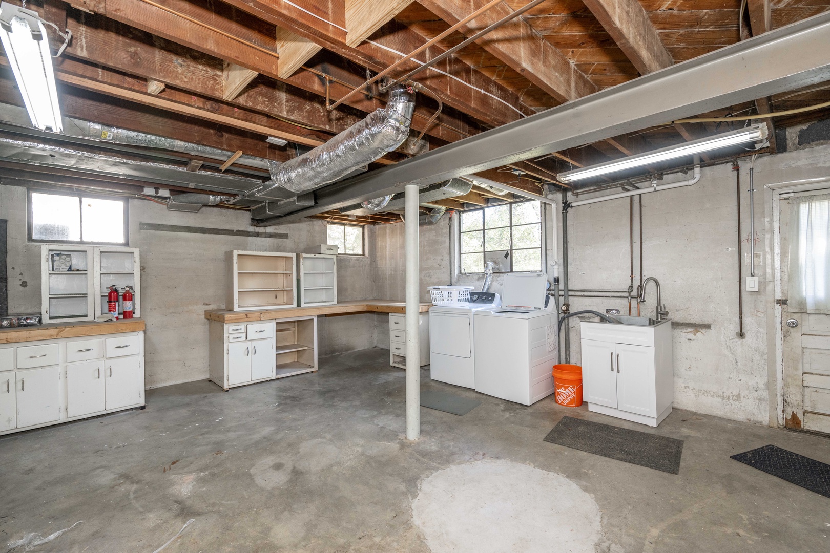 Private laundry is available for your stay, tucked away in the basement