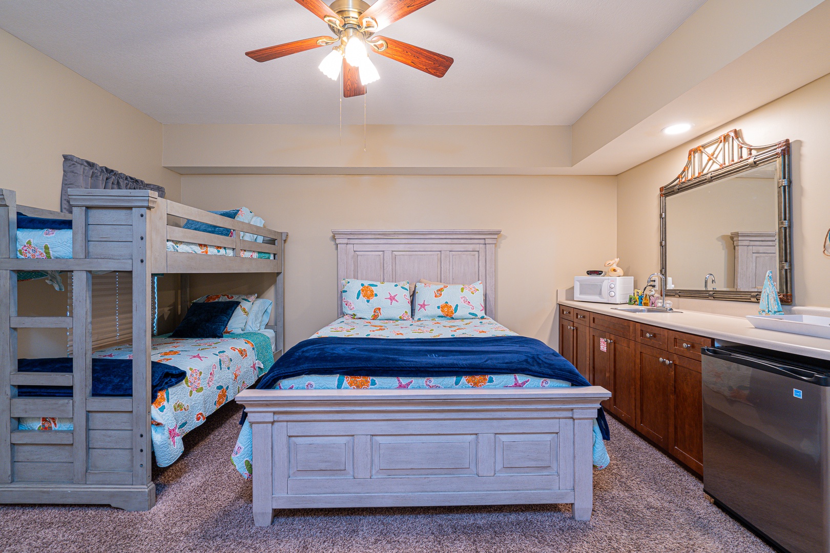 The final suite offers a private ensuite, queen bed, twin bunks, kitchenette, & TV