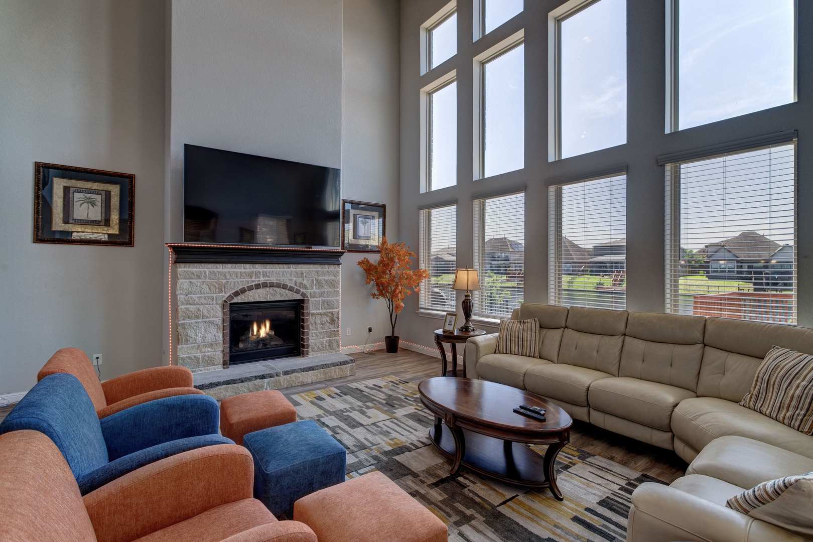 Bright living area with ample seating, fireplace, and Smart TV