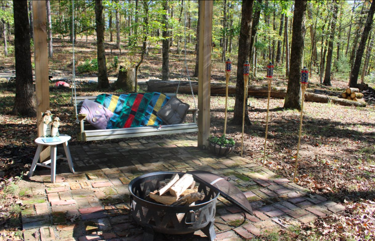 Outdoor scene with swing and fire pit