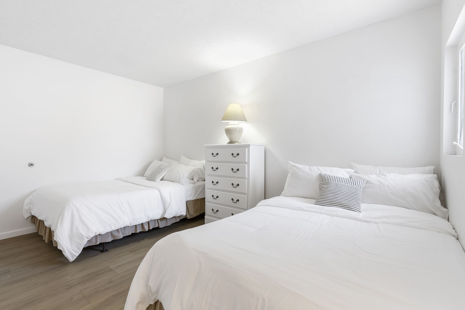 Unit 45: This bedroom on the 2nd floor includes a private en suite & 2 full-size beds