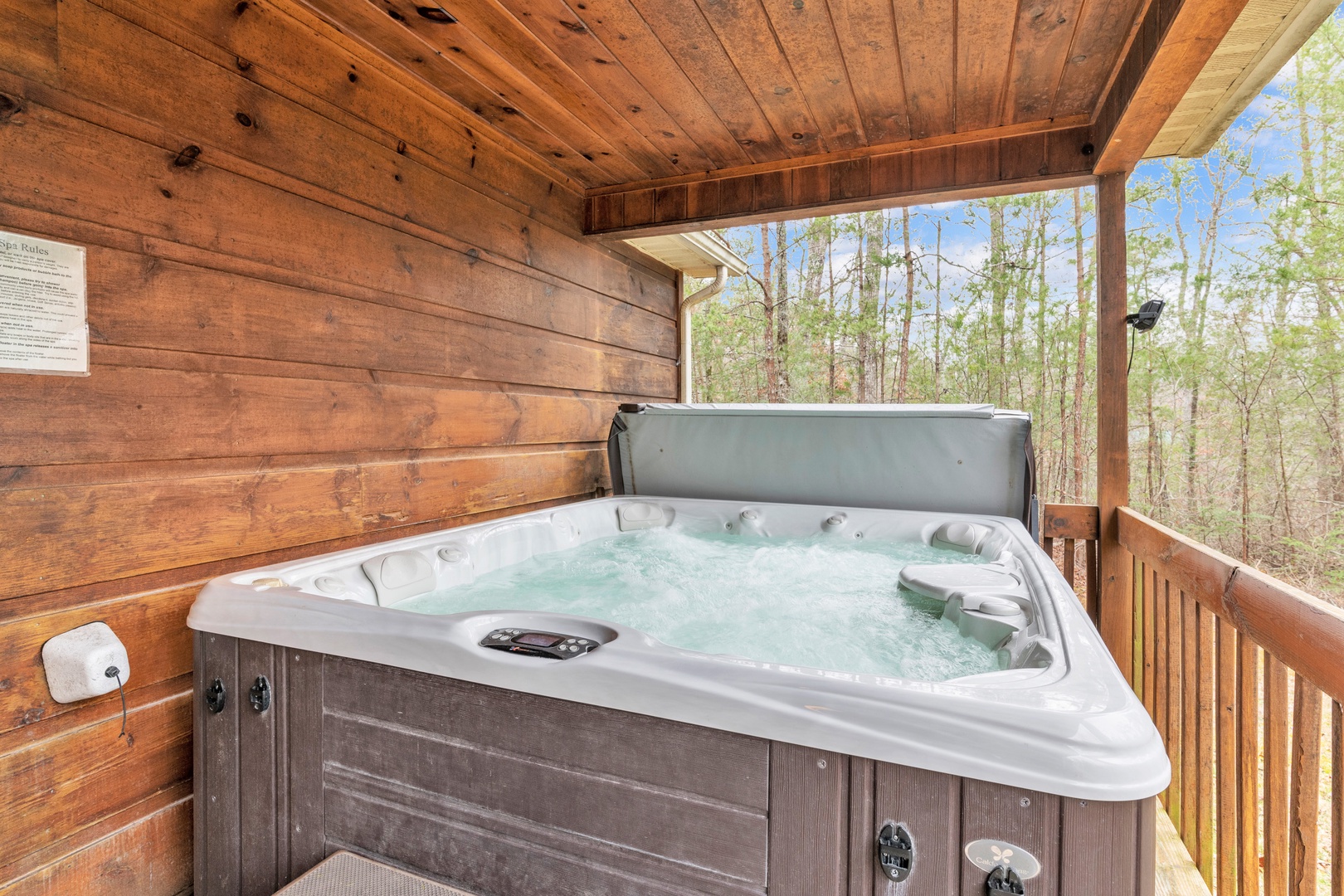 Soak your cares away with tranquil nature views in the private hot tub
