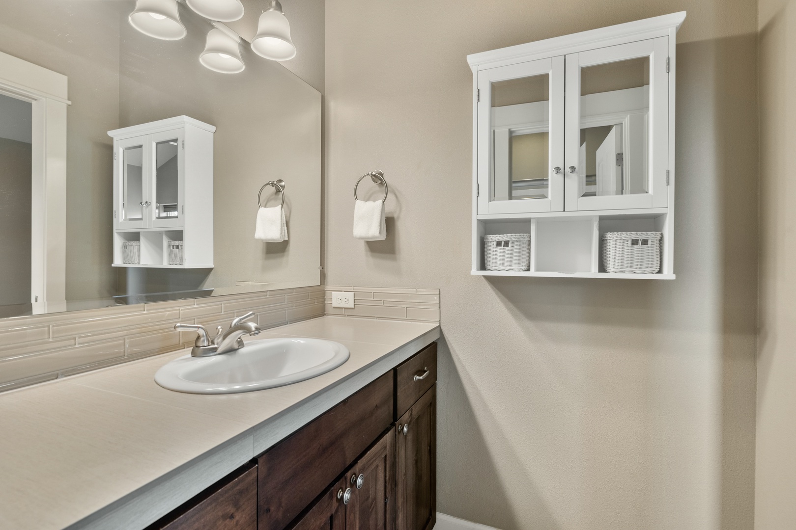 The master en suite includes an oversized single vanity & walk-in shower