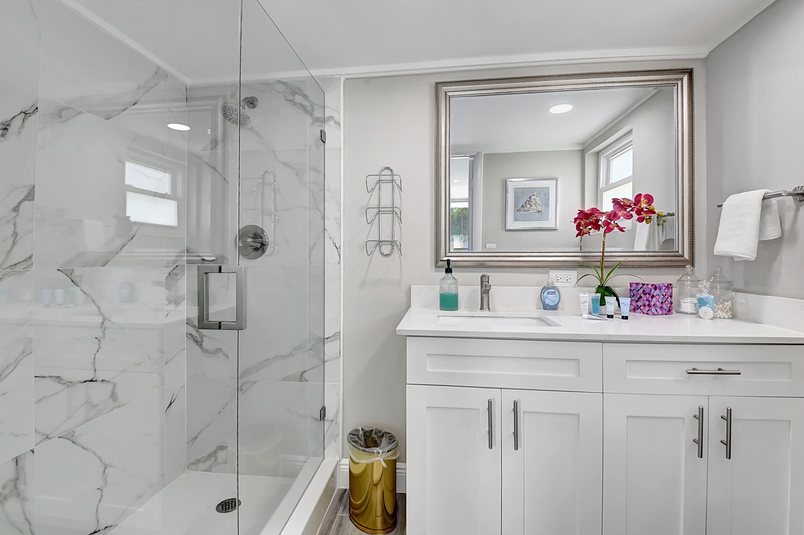 The queen en suite offers an oversized single vanity & glass shower