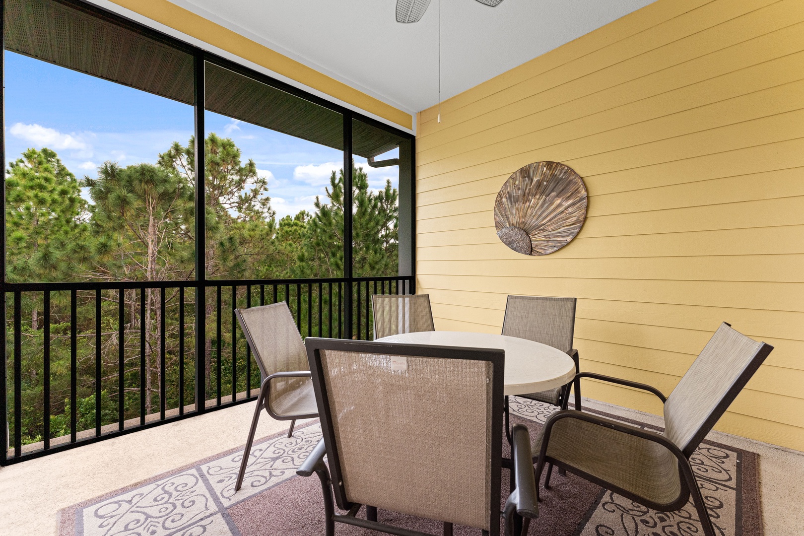 Enjoy morning coffee or dine alfresco on the breezy screened balcony