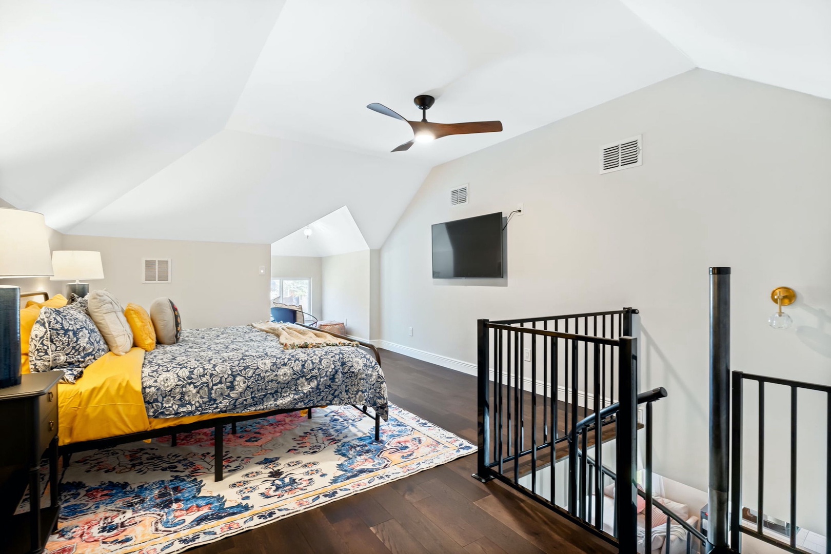 Enjoy the private space in the loft complete with king bed, TV & nook