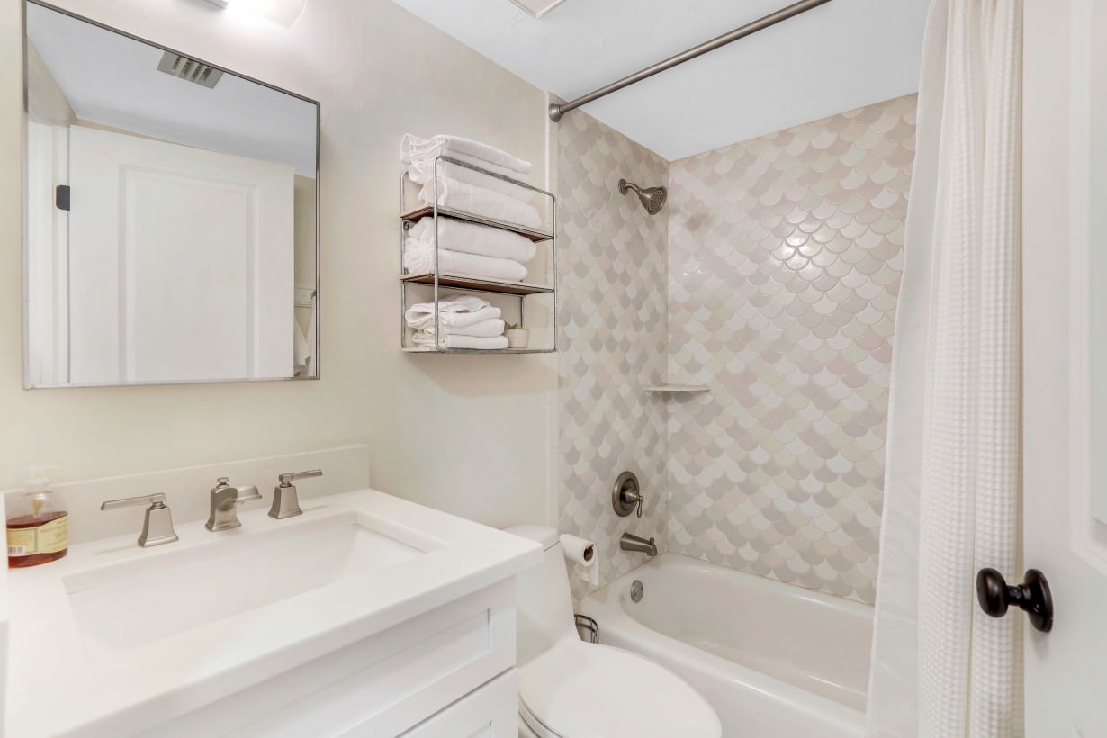 stackable washer & dryer out side of shared bathroom