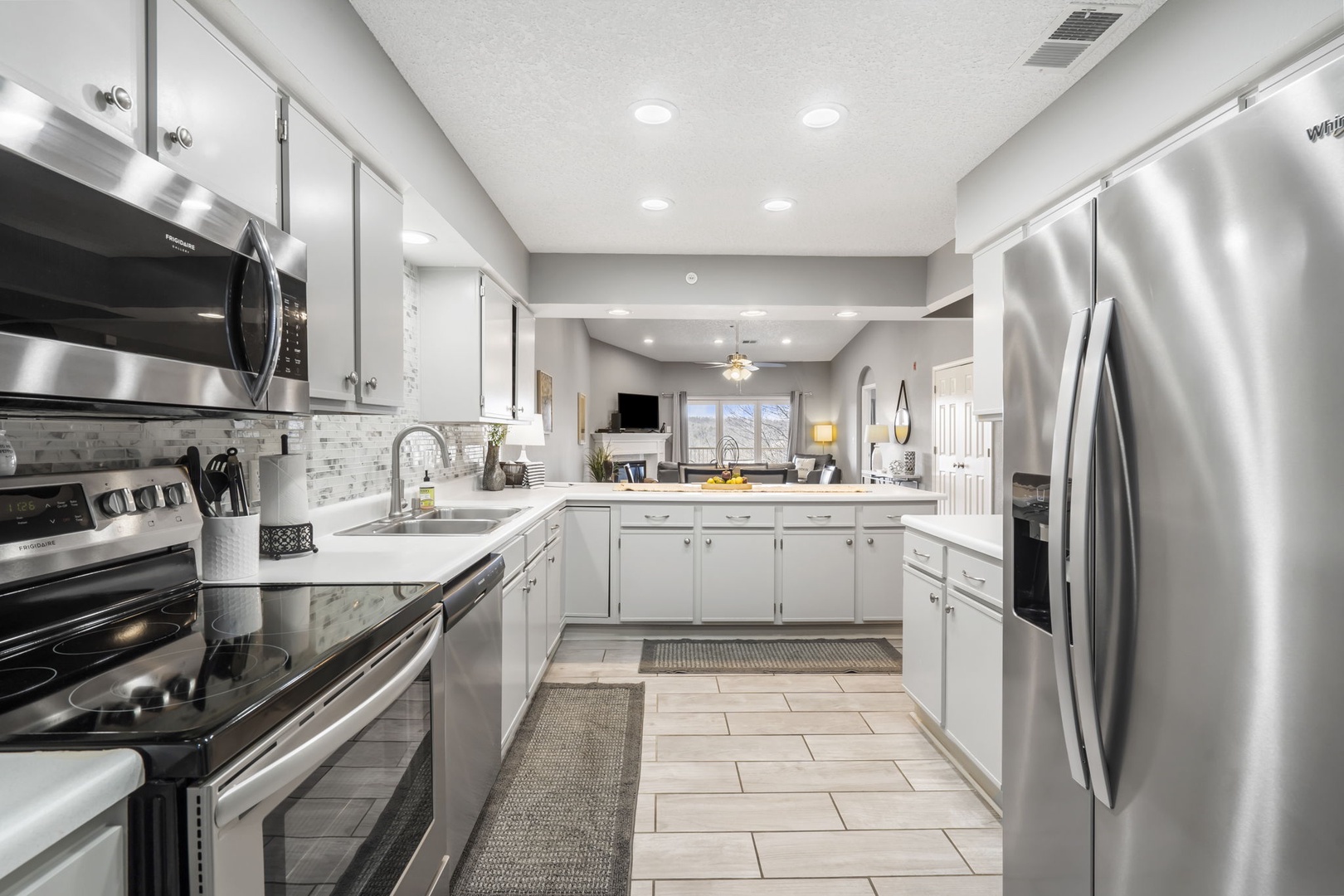 Unit 19: The sleek, updated kitchen is spacious & well-equipped for your visit