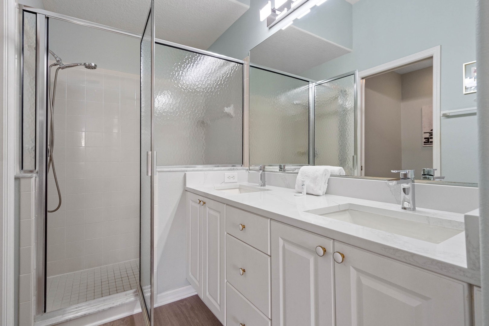 The King En Suite boasts a spacious Double Vanity and Glass Shower