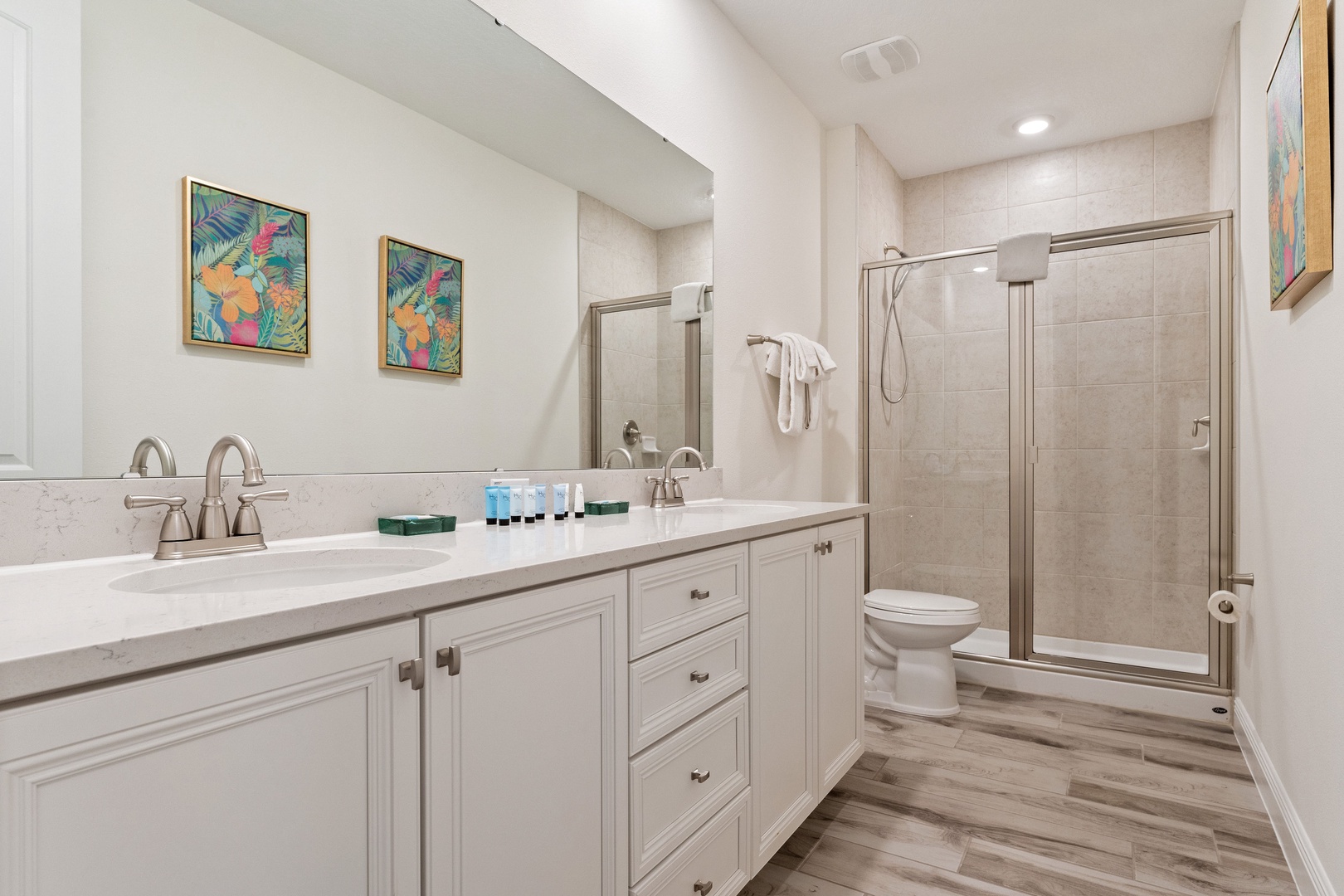 A double vanity & shower await in this large ensuite bath