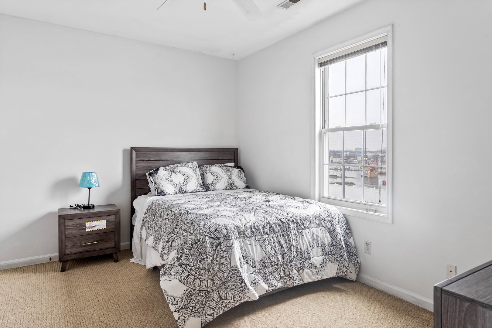 Bedroom 1 with queen bed, Smart TV, and ensuite