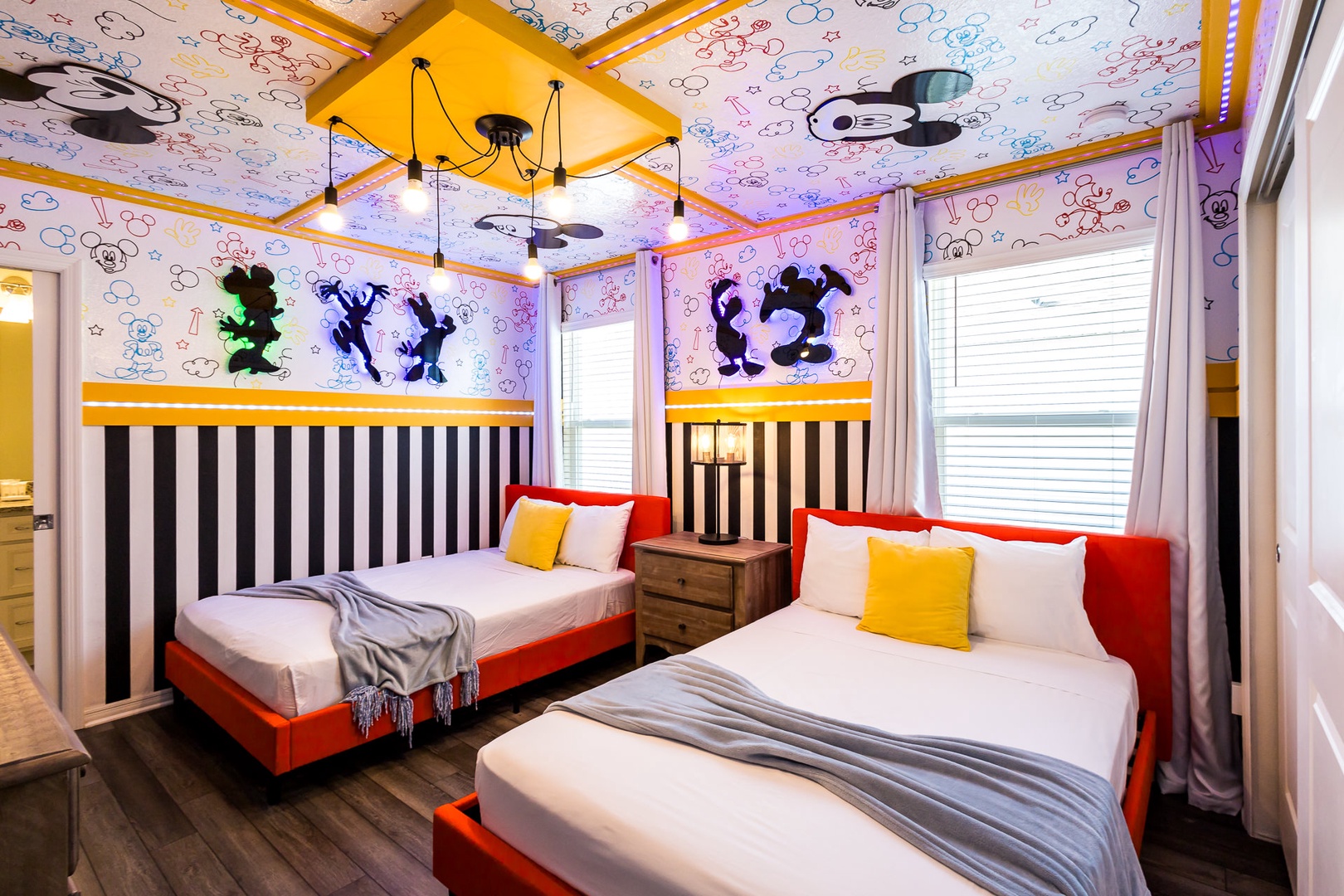 Oh Boy! This Mickey mouse themed room is furnished with 2 Full beds