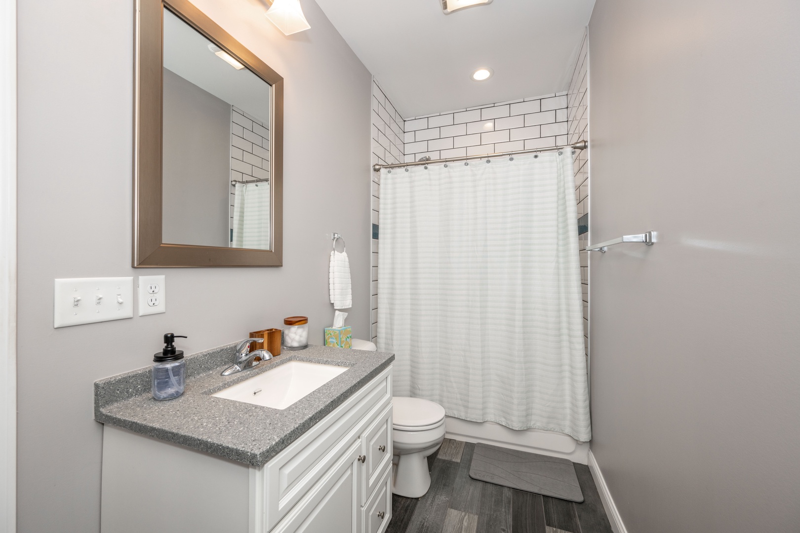 Wash up in the 2nd floor hall bath, offering a single vanity & shower/tub combo