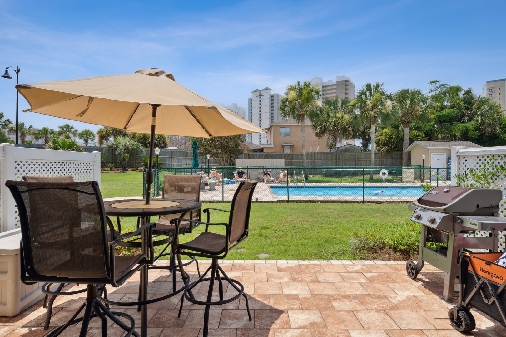 Outdoor seating with umbrella by the pool