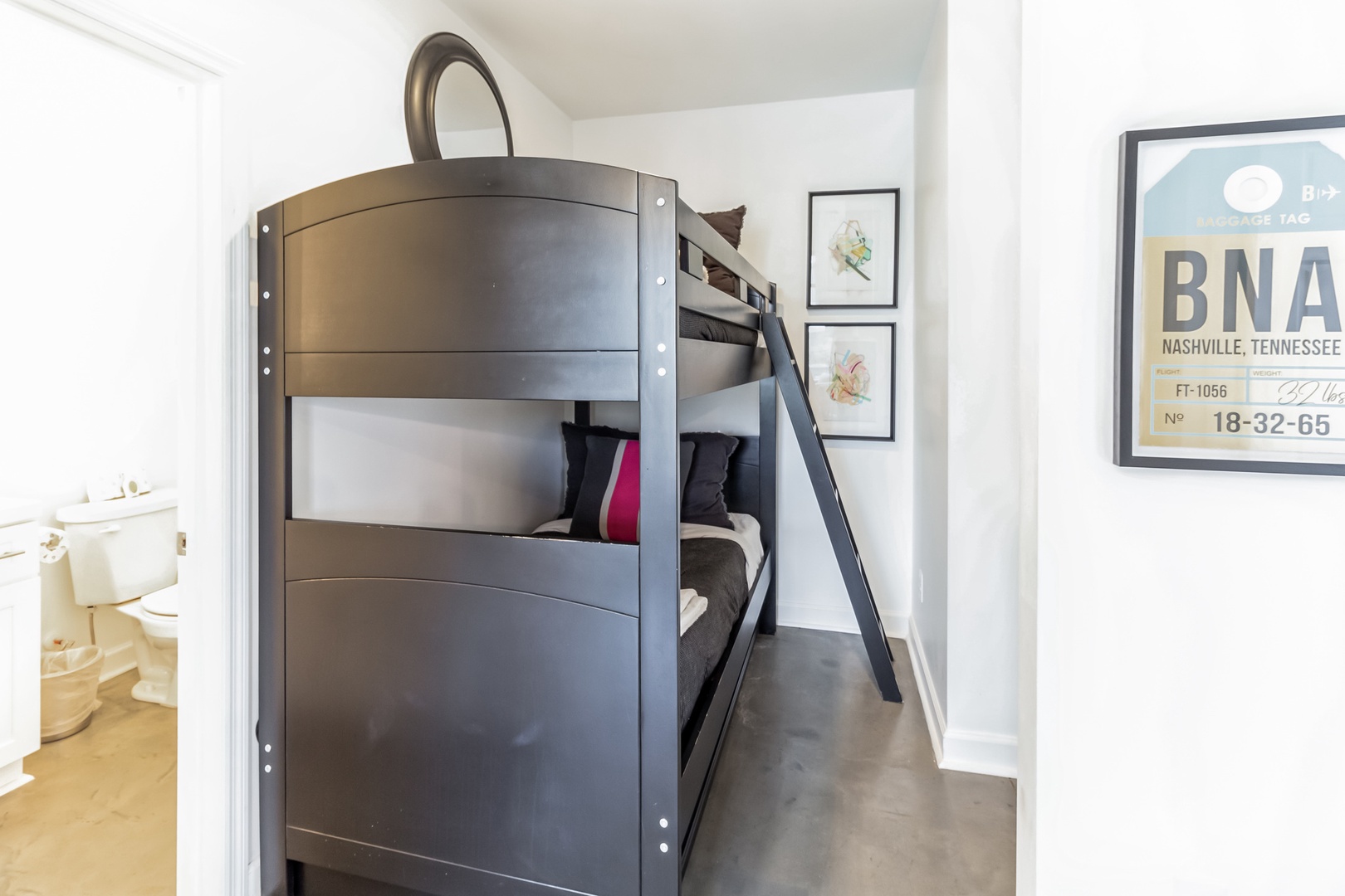 Twin-over-twin bunks are tucked away in the serene alcove off the living area