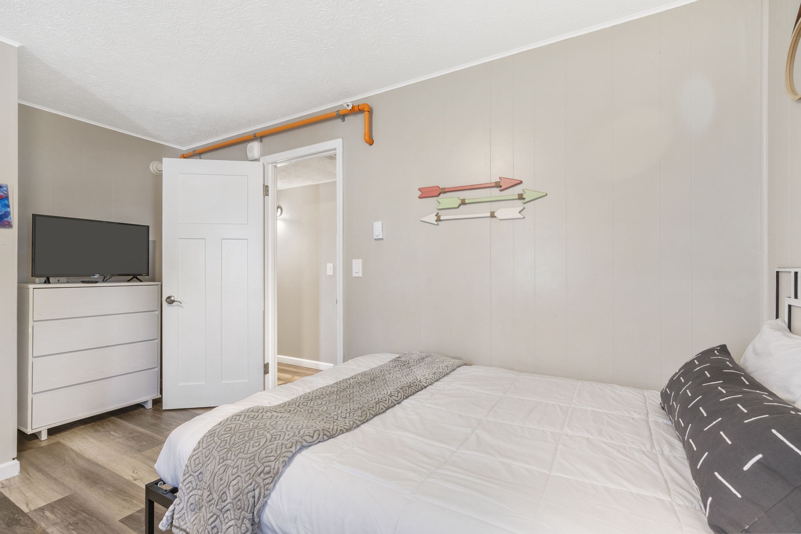 A pair of comfy double beds & Smart TV await in the 3rd main-level bedroom