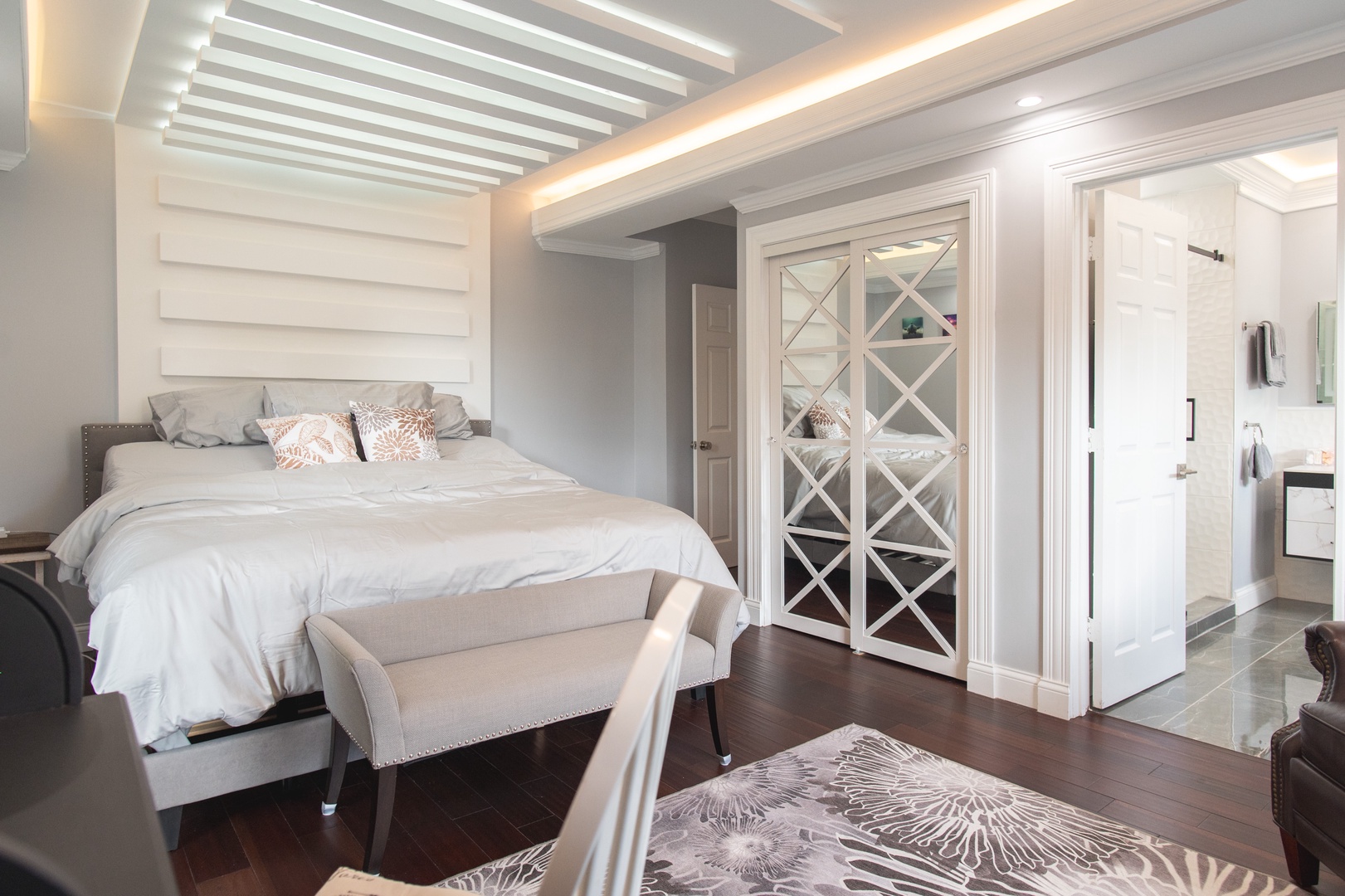 The 2nd level queen suite boasts a private en suite, Smart TV, & desk space
