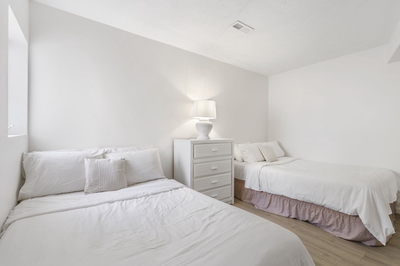 Unit 41: This 1st floor bedroom includes a pair of cozy full-sized beds