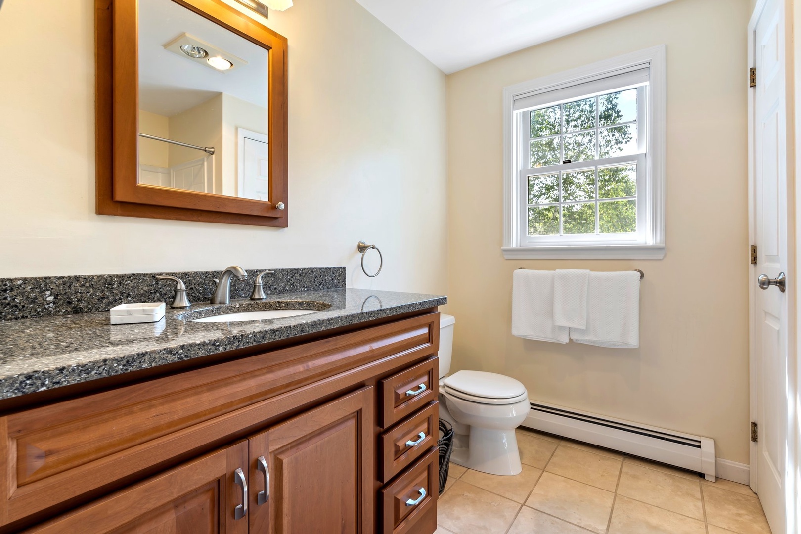 The queen ensuite includes a single vanity & shower/tub combo