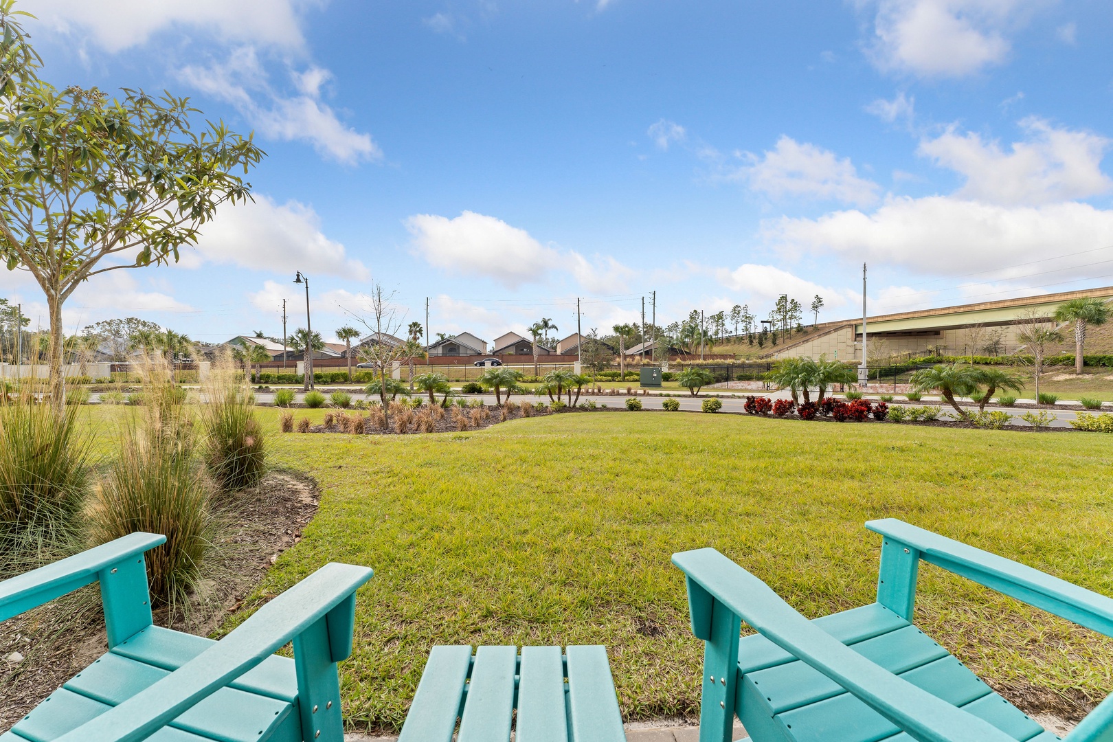 A pair of Adirondack chairs with a charming side table, ready for relaxation on the patio