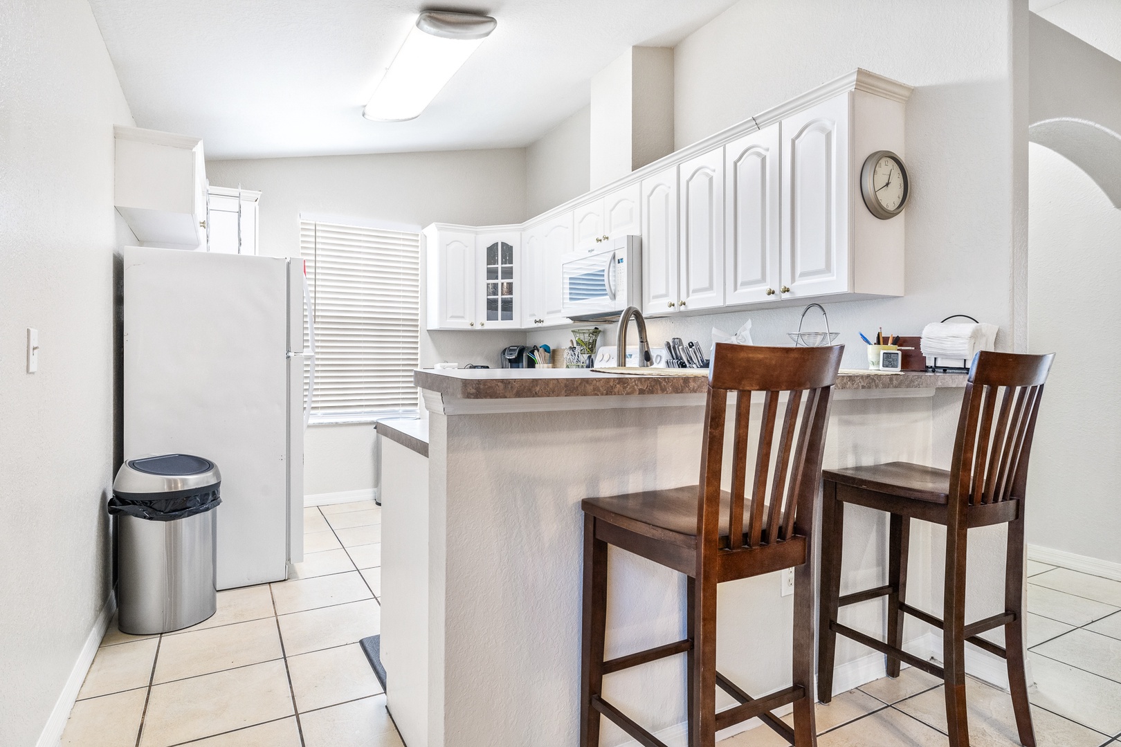 Sip morning coffee or grab a bite at the kitchen counter, with space for 2