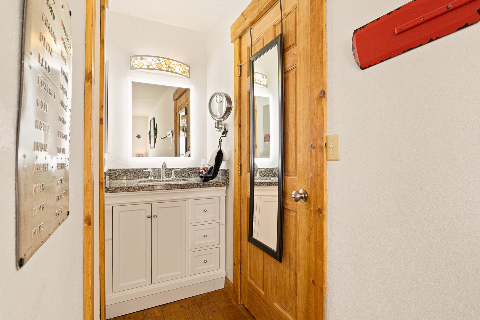 This ensuite bathroom features a shower/tub combo and a single vanity.