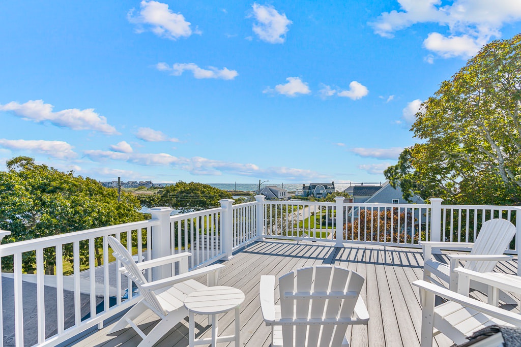 Large rooftop deck with outdoor seating
