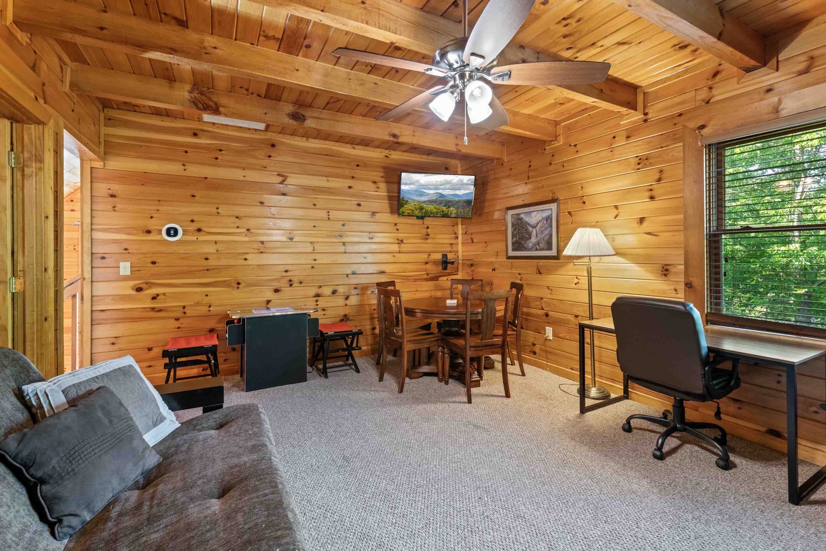 Loft with arcade game, twin/twin bunk bed, and queen size futon