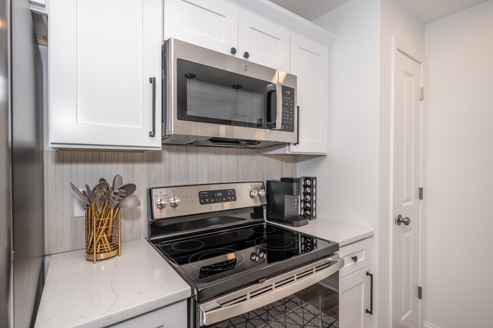 Unit 101: The fully-equipped kitchen offers tons of space & amenities