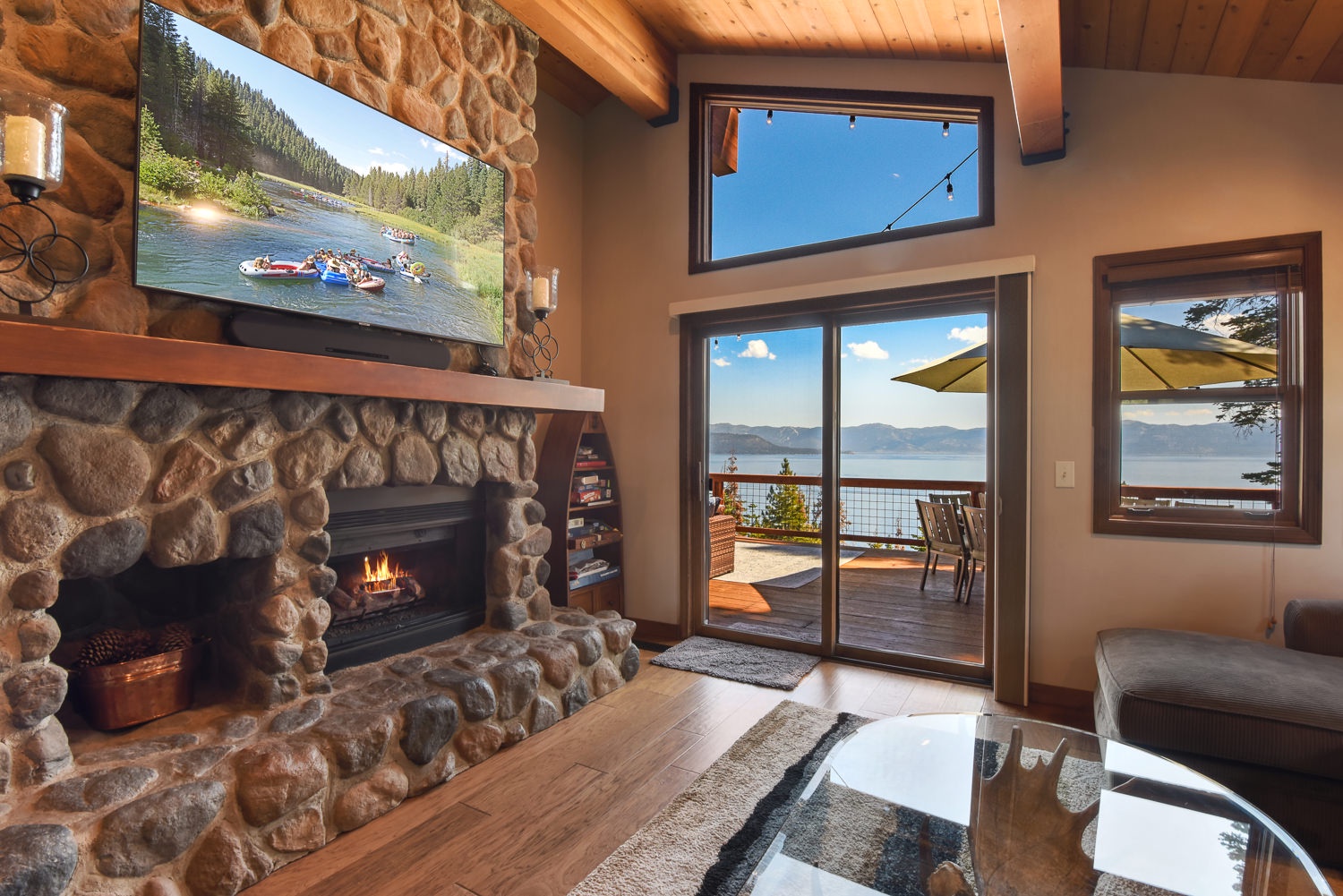 Living room with lake view, TV, fireplace
