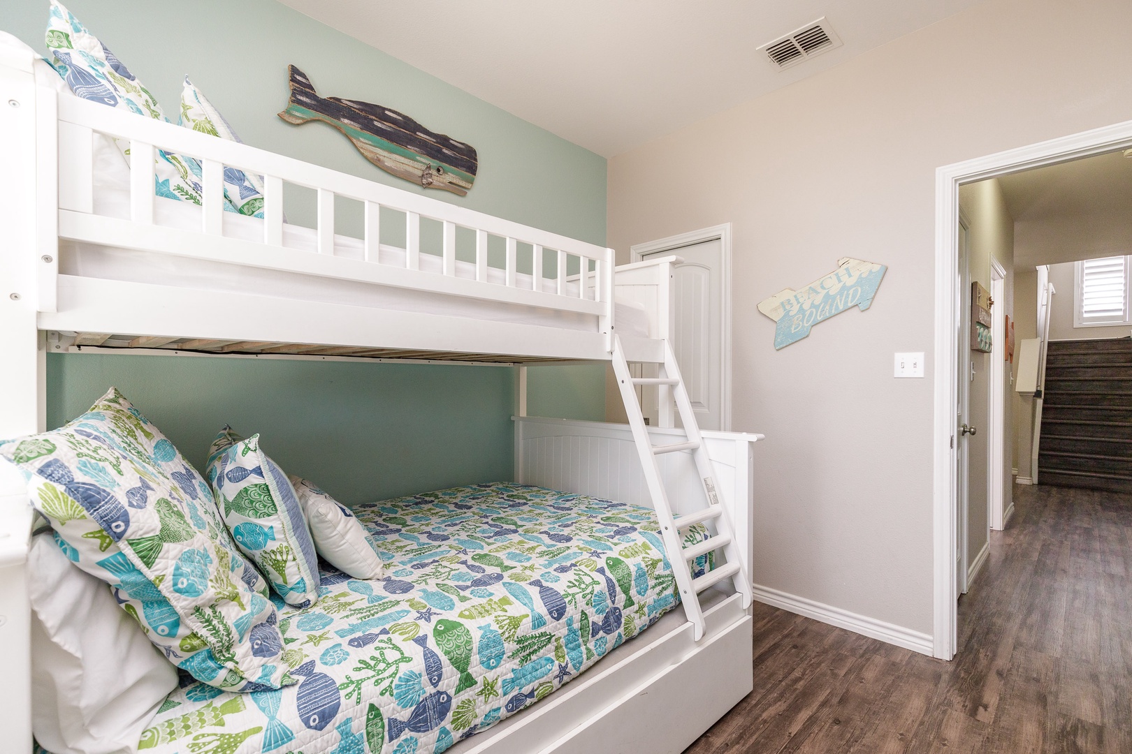 The 3rd of 3 bedrooms on the 1st floor offers twin-over full bunks & Smart TV