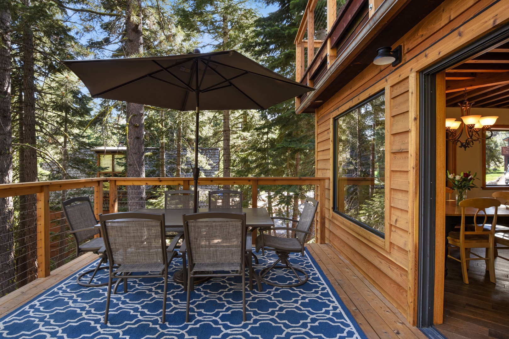 Balcony with BBQ, patio seating, and filtered lake views