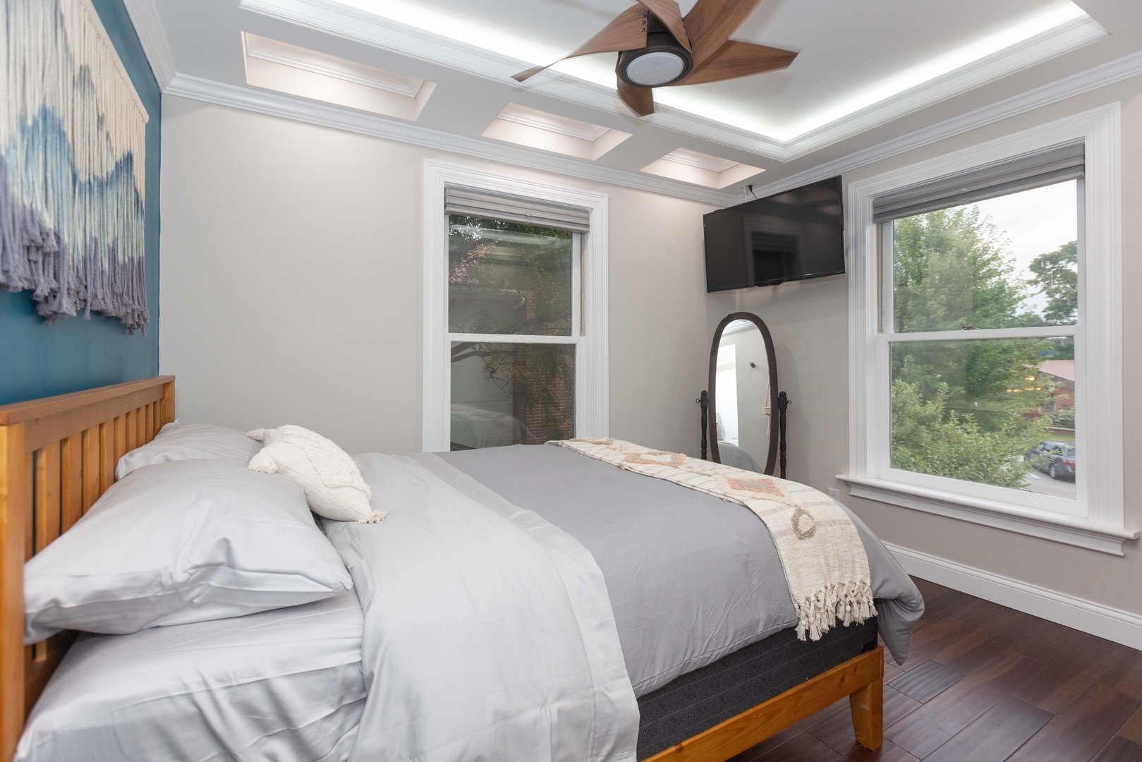 This 2nd floor main house queen bedroom includes a Smart TV & ceiling fan