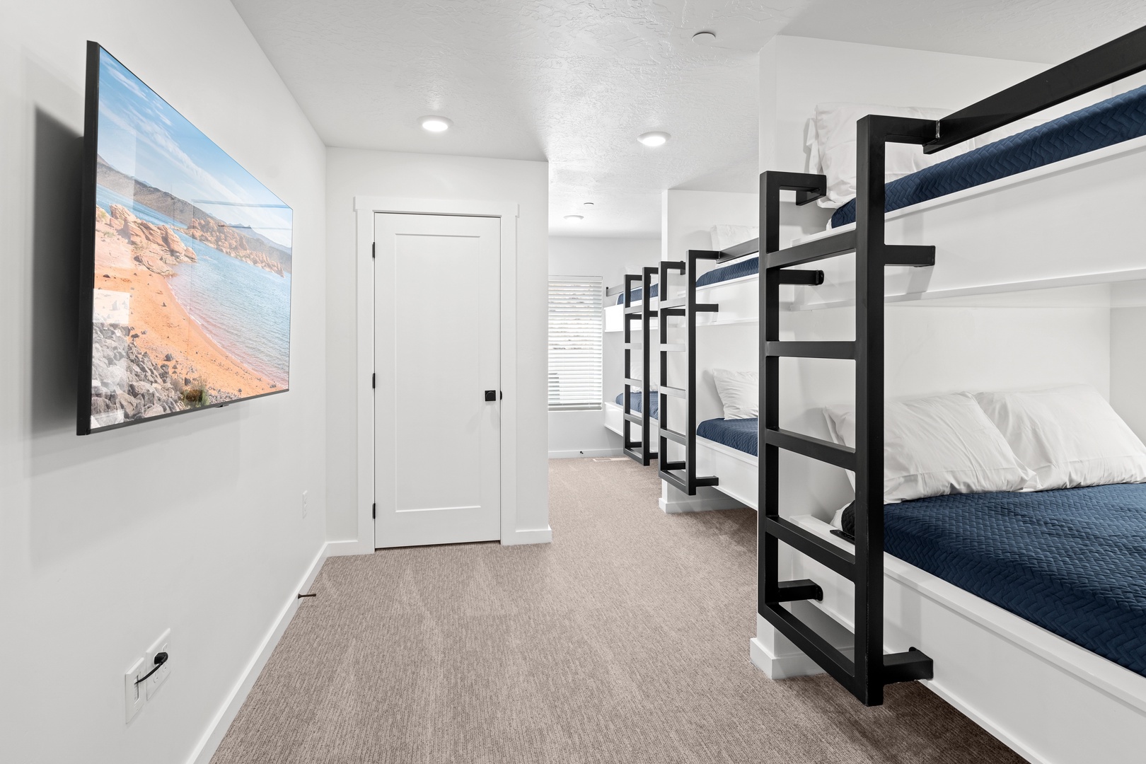 The 3rd-floor bunk suite, with full-over-full & twin bunks, ensuite, & smart TV