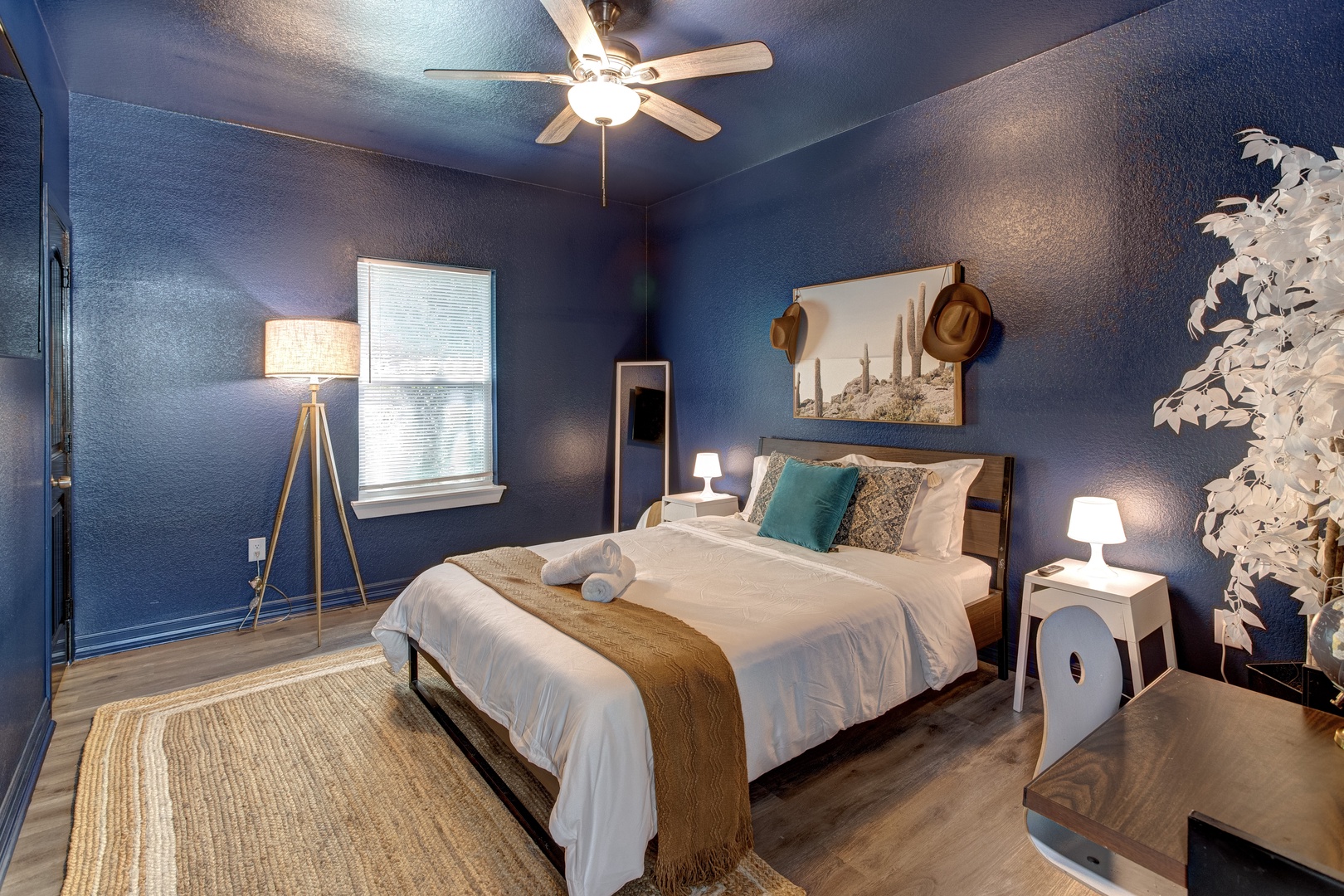 The second bedroom retreat features a plush queen bed & Smart TV